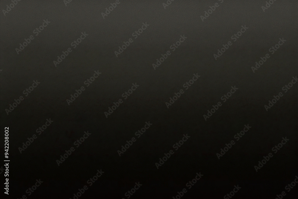 Black background made of real, shiny black paper covered with foil, illuminated by a soft light from above. Black background made of real, shiny black paper covered with foil, illuminated by a soft light from above.