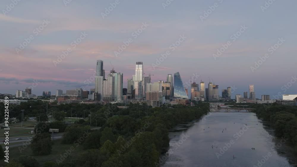 Pushing in to an aerial shot of downtown Austin, Texas. Lady bird in view with paddle boarders and cars driving home from work. Pushing in to an aerial shot of downtown Austin, Texas. Lady bird in view with paddle boarders and cars driving home from work.