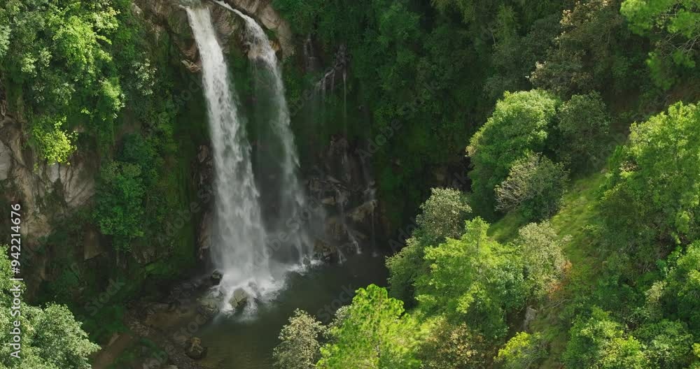 Drone shot of beautiful waterfall in wild forest of Nepal landscape covered dense trees, serene untouched natural environment waterfall greenery, show tranquil beauty of Nepal hill forests monsoon Drone shot of beautiful waterfall in wild forest of Nepal landscape covered dense trees, serene untouched natural environment waterfall greenery, show tranquil beauty of Nepal hill forests monsoon