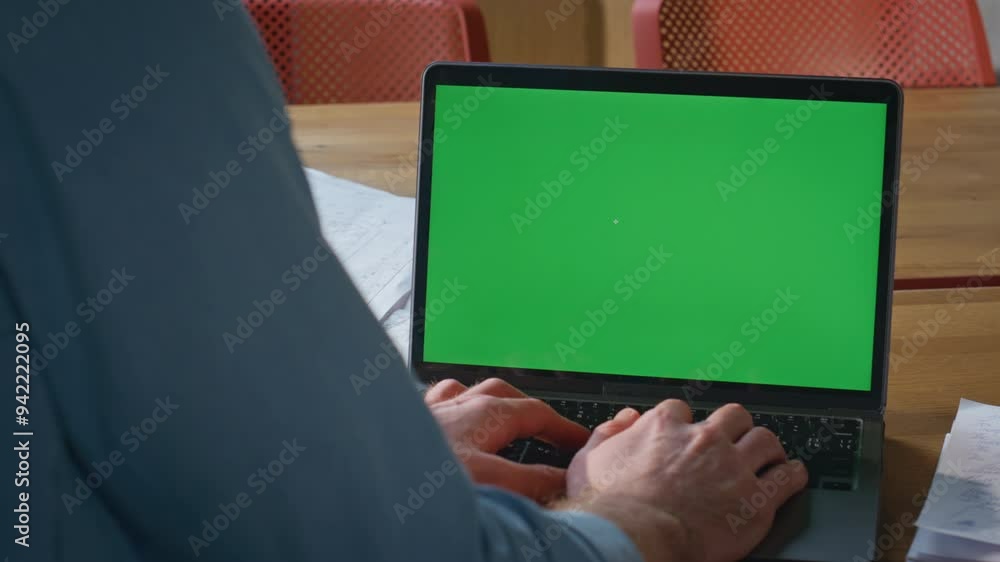 Unrecognizable businessman working chroma key laptop in modern workplace closeup Unrecognizable businessman working chroma key laptop in modern workplace closeup