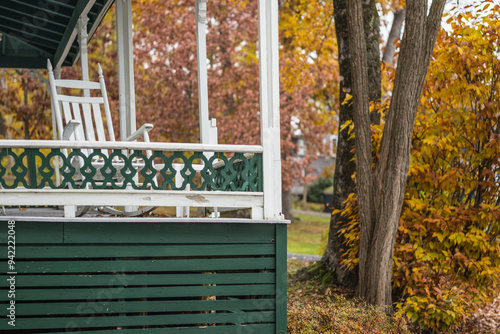 USA, Maine, Bayside. Bayview Cottages, oceanside community at a former religious themed resort porch during autumn.