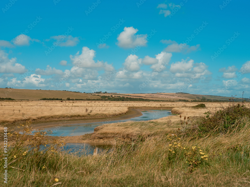 Peaceful Countryside Landscape with Rolling Hills and Blue Sky Peaceful Countryside Landscape with Rolling Hills and Blue Sky