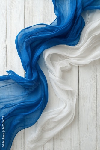 Colorful wooden planks with peeling paint in blue, white, and red arranged ve...