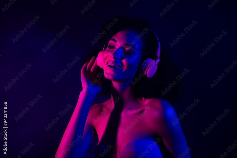 Photo of adorable shiny lady wear lingerie headphones listen songs empty space isolated dark blue color background