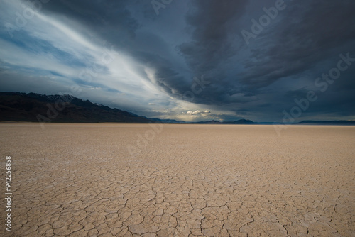 Usa, Oregon, Alvord Desert. Approaching rain storm and clouds over the parched mud patterns