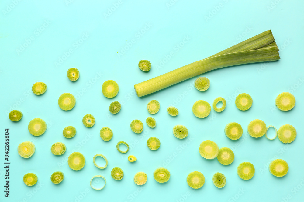 Slices of fresh leek on blue background Slices of fresh leek on blue background