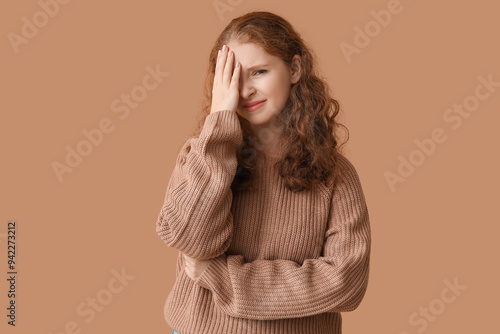 Portrait of ashamed young w...