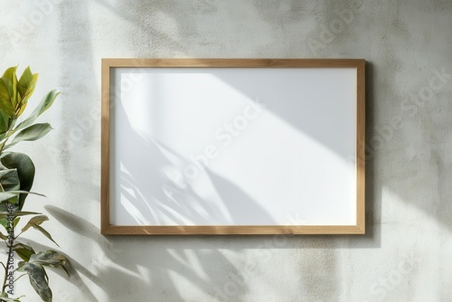 Blank picture frame mockup on wall. Light room minimal design. View of modern scandinavian style interior with artwork mock up on wall. Home staging and minimalism concept photo