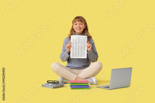 Happy female student with r...