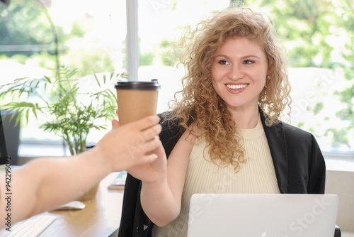Smiling young businesswoman...