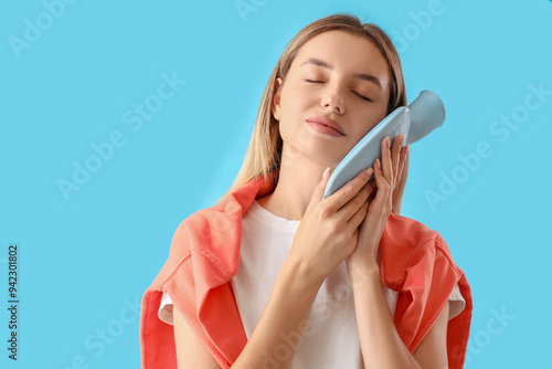 Young woman with hot-water ...