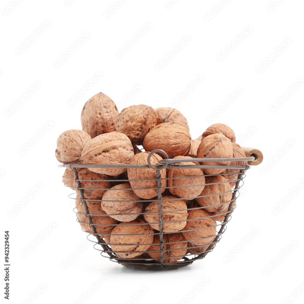 Basket with tasty walnuts on white background Basket with tasty walnuts on white background