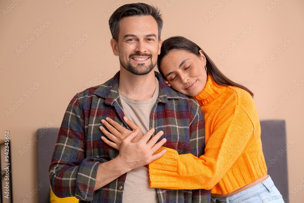 Young couple hugging in bedroom on autumn day Young couple hugging in bedroom on autumn day