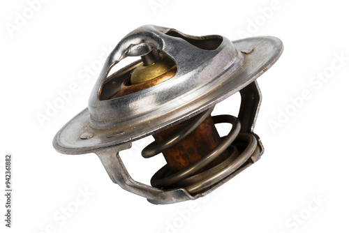 Studio photography of an engine coolant thermostat isolated on a white background. Side view of used car component for vehicle engine. Close-up shot, spare parts for service and maintenance. 