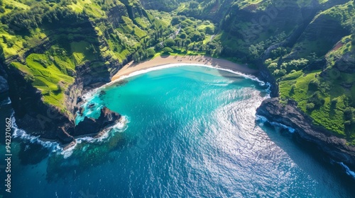 Take a breathtaking aerial photo of a secluded beach surrounded by lush green cliffs and sparkling blue ocean.