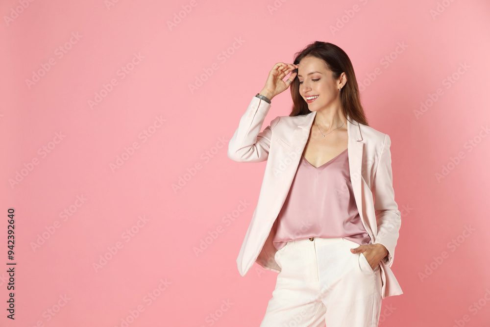 Beautiful woman in stylish white suit on pink background, space for text Beautiful woman in stylish white suit on pink background, space for text