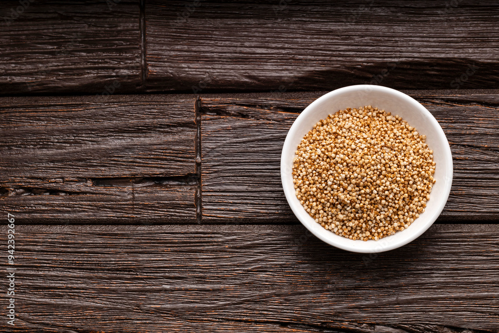 Amaranthus - Bowl full of amaranth seed pops. wooden background Amaranthus - Bowl full of amaranth seed pops. wooden background
