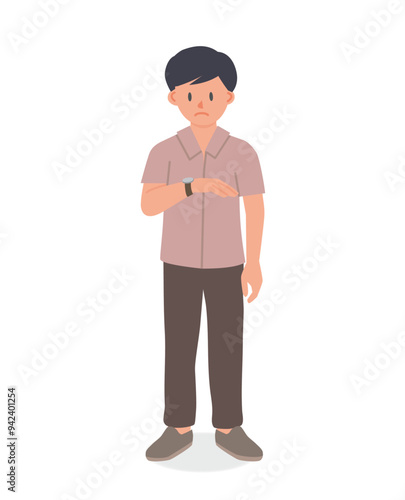 impatient man looking at his watch, while waiting for something
