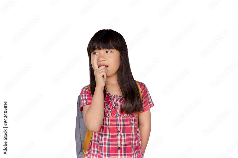 Happy little Asian girl Looking and pointing sideways while standing on a white background in a cute, relaxed, fun, carefree pose. Concept of happiness. Happy little Asian girl Looking and pointing sideways while standing on a white background in a cute, relaxed, fun, carefree pose. Concept of happiness.