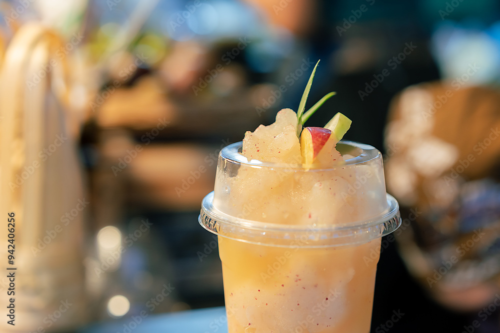 Close-up view of healthy fruit juice drinks Decorate with apple slices on top. Fruit smoothies to cool down with benefits, containing vitamins, fiber, and ideas about good health. Close-up view of healthy fruit juice drinks Decorate with apple slices on top. Fruit smoothies to cool down with benefits, containing vitamins, fiber, and ideas about good health.