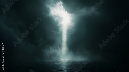 A Ray of Hope: A single beam of light pierces through a dark, stormy sky, illuminating the surface of a calm body of water, offering a glimmer of hope and promise in the midst of adversity. 