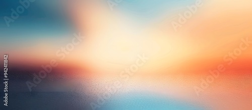 Vibrant orange and blue gradient background with soft, blurred clouds