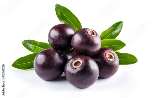 A cluster of dark purple berries with green leaves, showcasing freshness and natural beauty.