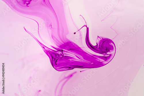 abstract background of pink and purple ink splashing on white background