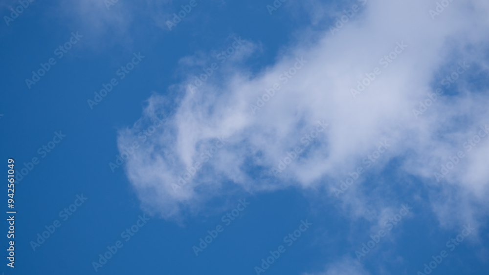 A Clear Blue Sky Accompanied by Gentle, Wispy Clouds on a Perfect Day Outdoors A Clear Blue Sky Accompanied by Gentle, Wispy Clouds on a Perfect Day Outdoors