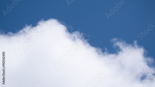 A Serene Day Captured in the Soft, Fluffy Clouds Against the Bright Blue Sky