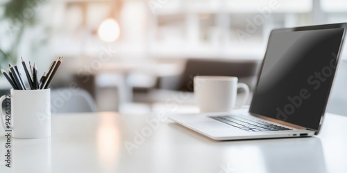 Wallpaper Mural Blurred Modern Office Interior with Laptop and Coffee Cup on White Table, Minimalist Home Workspace for Online Education or Remote Business Concepts Torontodigital.ca