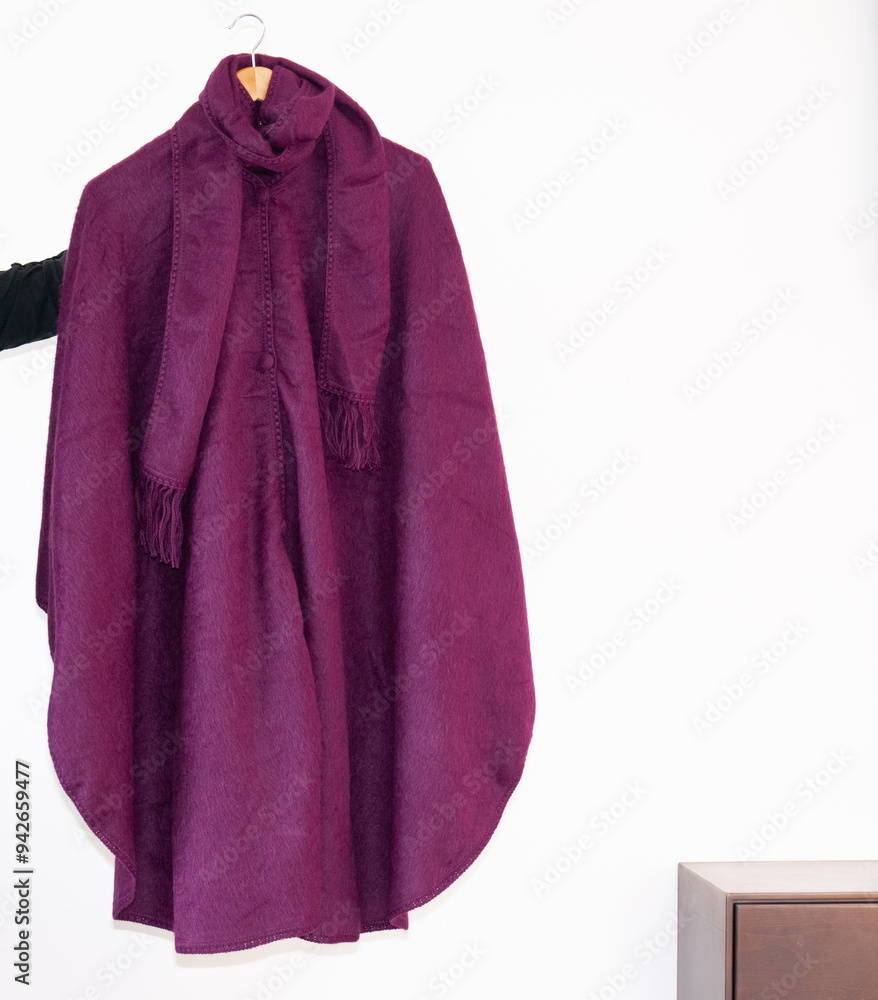 Hand embroidered alpaca wool poncho, colorful, black poncho on white background, no people, Ecuadorian poncho, Andean, handicraft. Hand embroidered alpaca wool poncho, colorful, black poncho on white background, no people, Ecuadorian poncho, Andean, handicraft.