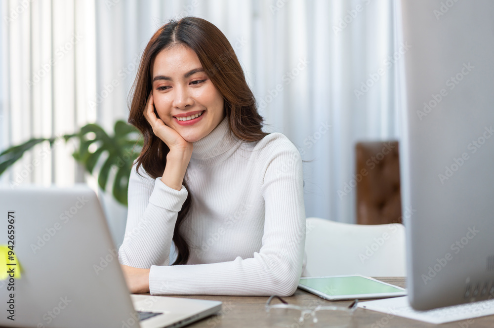 Young smiling asian woman relax using laptop conference work,learning education,study online,webinar podcast,creative woman looking at screen, shopping, online marketing at home