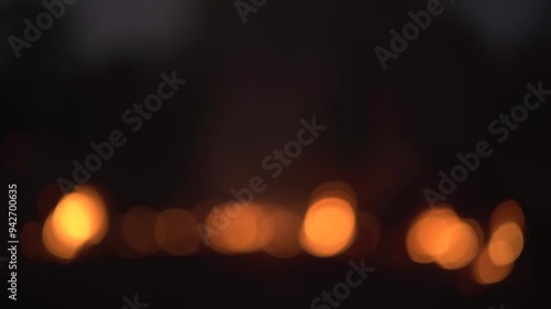 Night lights blurred, ghostly red light, twinkling.