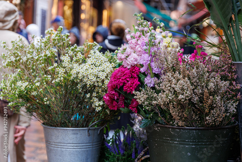 Bologna, Italy, 03.27.2024: Italian flower market with fresh flowers pots close up at Bologna, Italy