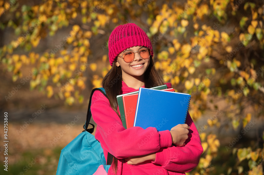 smiling teen girl ready to study at school with boos for education and knowledge outdoor smiling teen girl ready to study at school with boos for education and knowledge outdoor