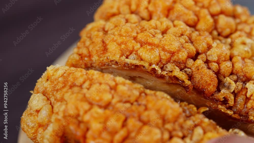 Close-up of crispy pork belly cracking on a wooden tray, the golden, crunchy texture and savory aroma. The distinct sound of the crackling adds to the visual appeal, delicious and indulgent quality Close-up of crispy pork belly cracking on a wooden tray, the golden, crunchy texture and savory aroma. The distinct sound of the crackling adds to the visual appeal, delicious and indulgent quality