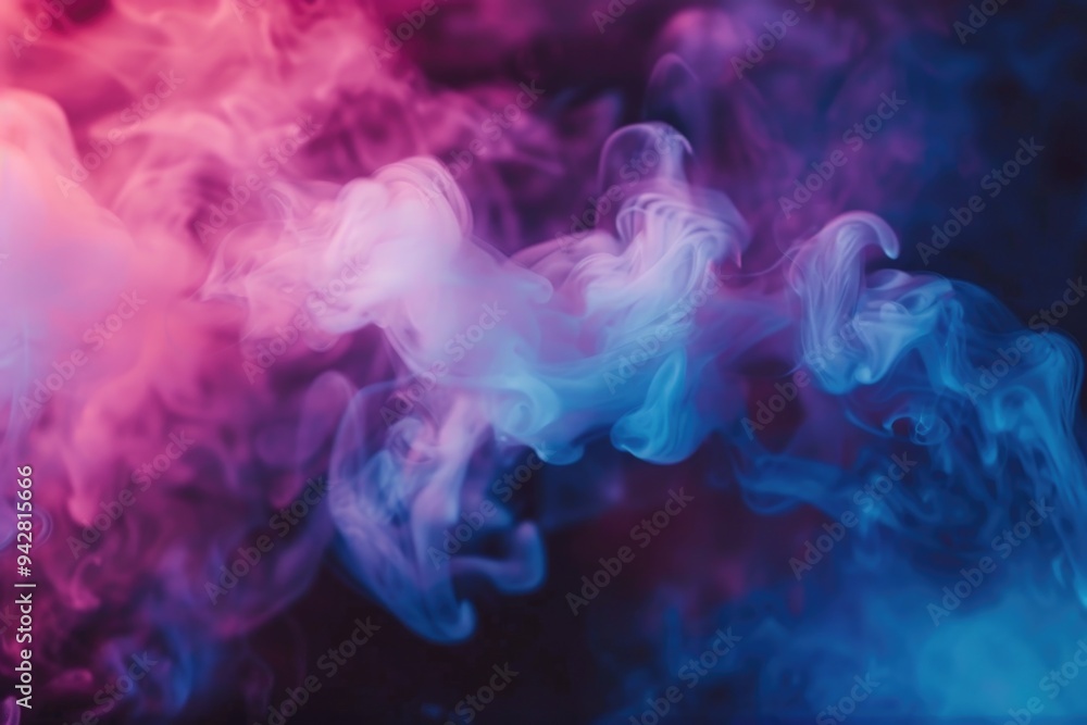 Obraz premium A hazy cloud of blue and pink smoke fills the air, creating a misty atmosphere