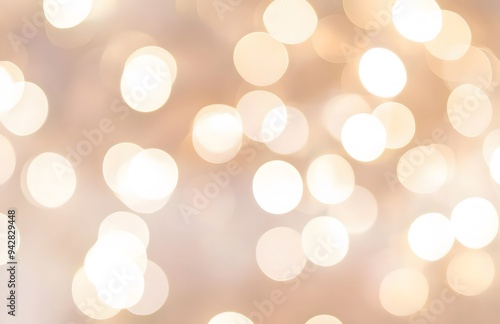 Defocused abstract bokeh background beige pastel colored, flare from lights, beige monochrome photo