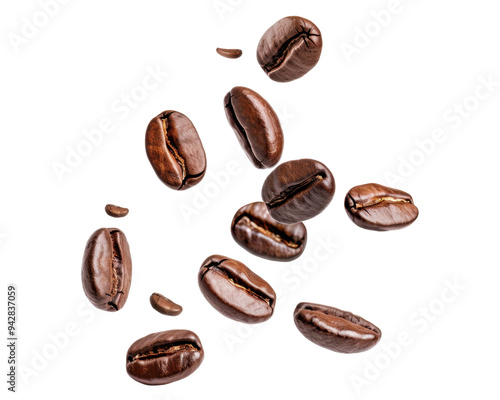 A collection of roasted coffee beans scattered on a surface.