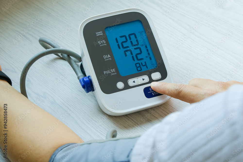 Man check blood pressure monitor and heart rate monitor with digital pressure gauge. Health care and Medical concept
Man check blood pressure monitor and heart rate monitor with digital pressure gauge. Health care and Medical concept