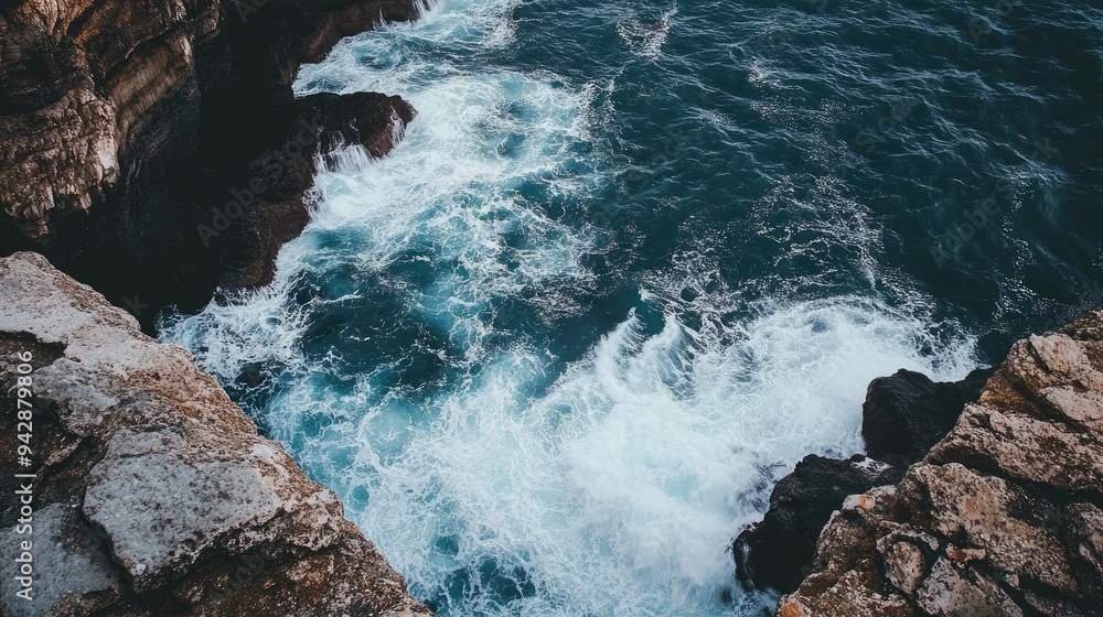 A stunning cliffside view of the ocean with waves crashing against the rocks, offering space for text above. Perfect for coastal, travel, or adventure themes. A stunning cliffside view of the ocean with waves crashing against the rocks, offering space for text above. Perfect for coastal, travel, or adventure themes.