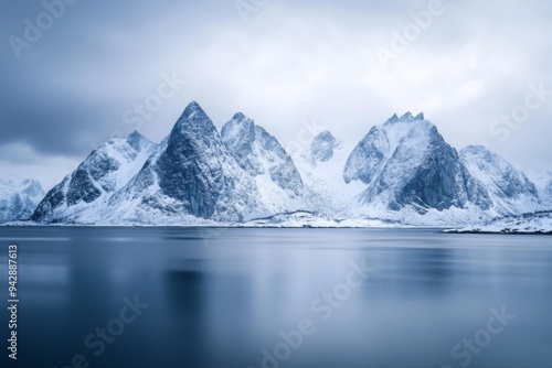 Wallpaper Mural Aesthetic photo of  snowy mountain range with sharp peaks, covered in snow and surrounded by calm waters  Torontodigital.ca