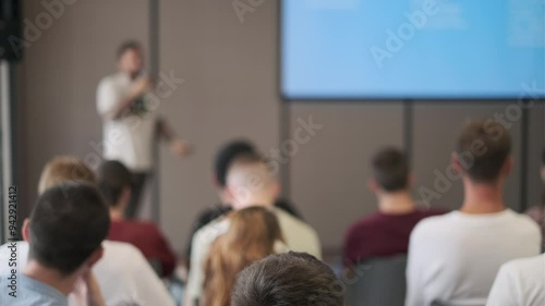 Wallpaper Mural Speaker presents in front of a focused audience during a seminar. The setting is professional and conducive to learning and engagement. Torontodigital.ca