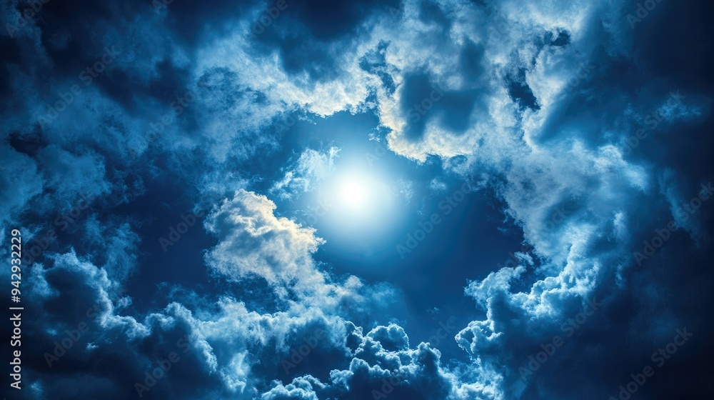 Fototapeta premium Moonlight shining through a break in the clouds, with space for copy.