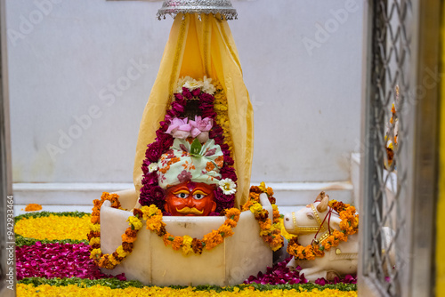 Shivling or shiv lingam decorated with colours and flowers to worship lord shiv. Selective focus. photo