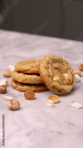 The cookies are golden brown with a slightly crispy edge and a soft, chewy center. Some cookies have chocolate chips