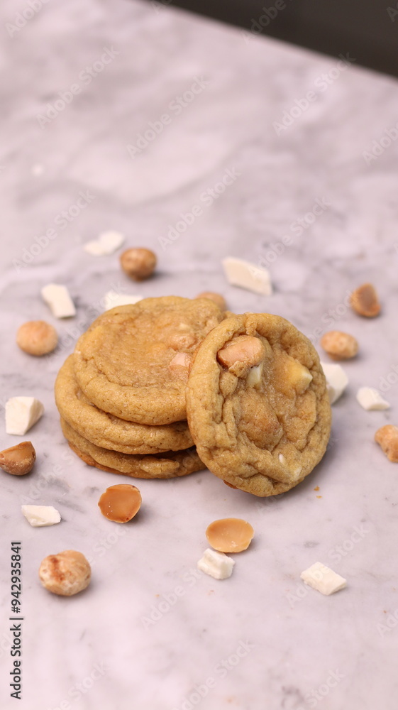 The cookies are golden brown with a slightly crispy edge and a soft, chewy center. Some cookies have chocolate chips The cookies are golden brown with a slightly crispy edge and a soft, chewy center. Some cookies have chocolate chips
