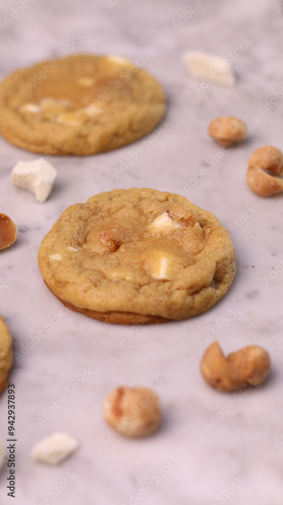 The cookies are golden brown with a slightly crispy edge and a soft, chewy center. Some cookies have chocolate chips The cookies are golden brown with a slightly crispy edge and a soft, chewy center. Some cookies have chocolate chips