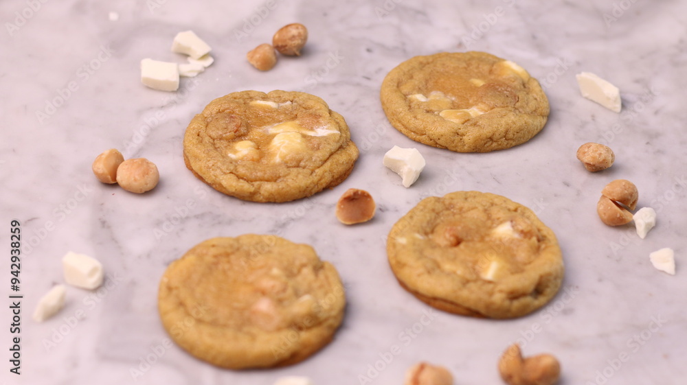 The cookies are golden brown with a slightly crispy edge and a soft, chewy center. Some cookies have chocolate chips The cookies are golden brown with a slightly crispy edge and a soft, chewy center. Some cookies have chocolate chips